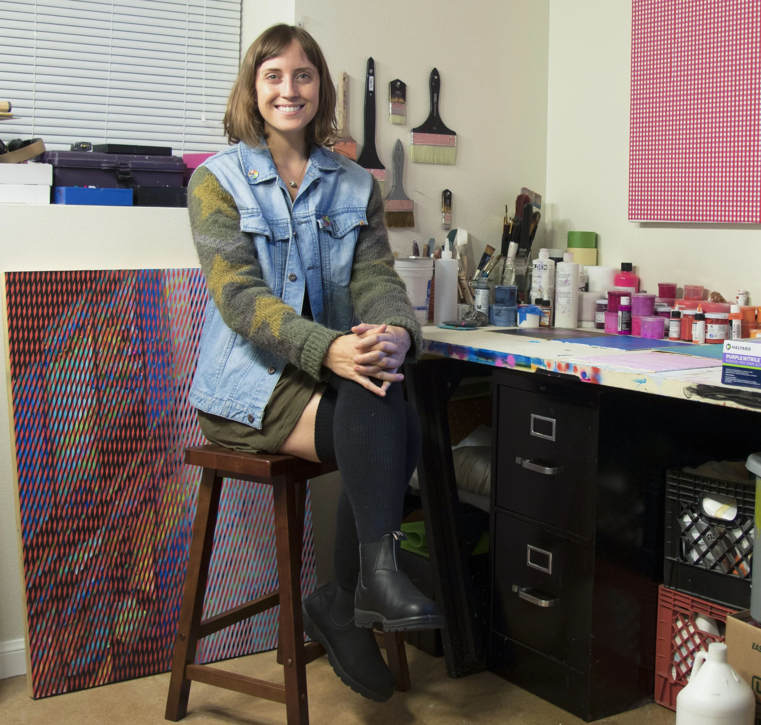 Rebecca Kaufman posing in her studio