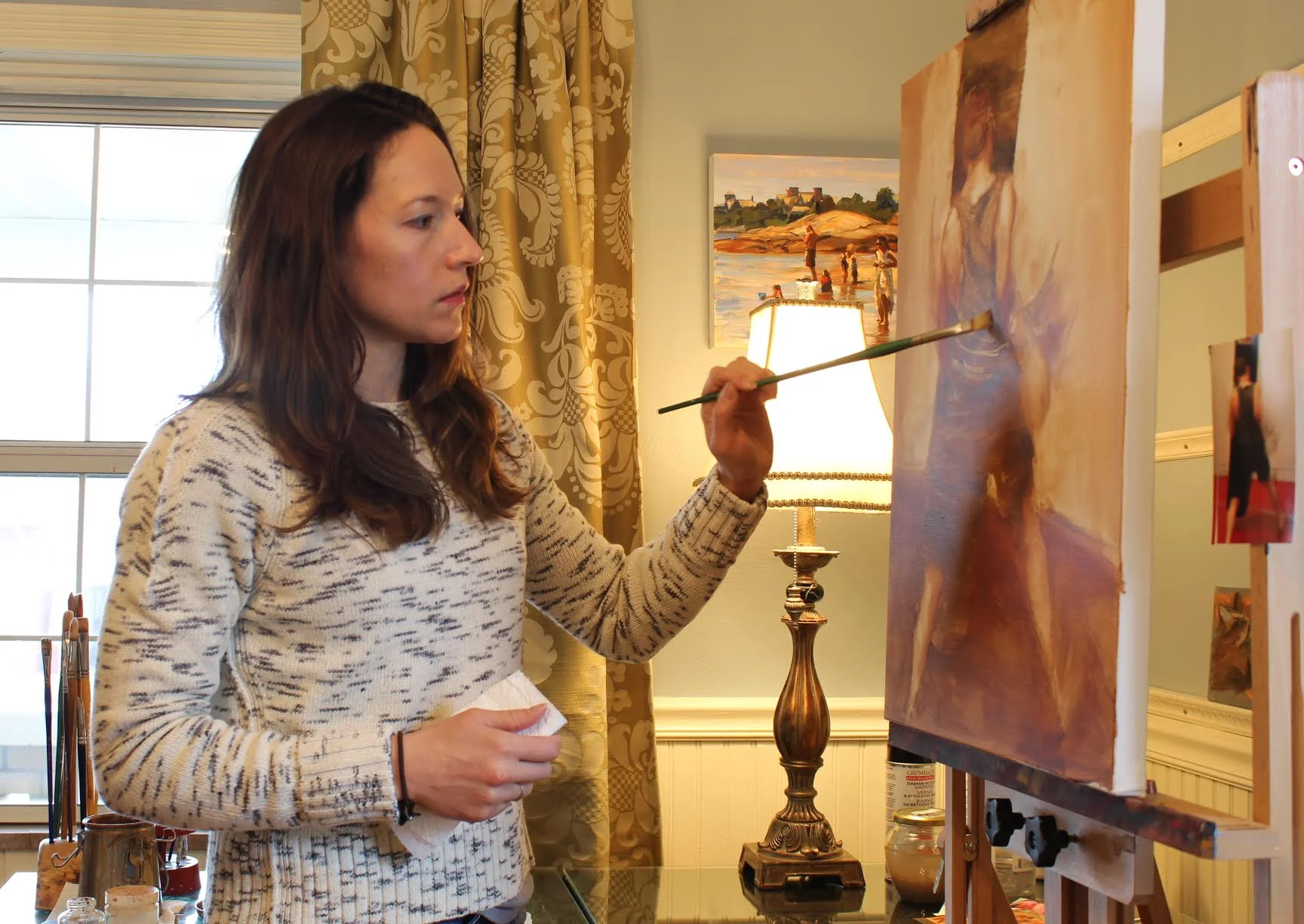 Artist Jonelle Summerfield working in her studio.
