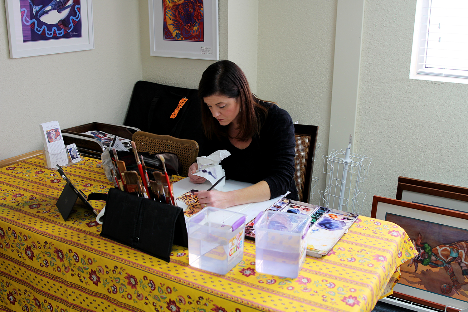 New UGallery artist Amy Rattner working with watercolors in her studio.