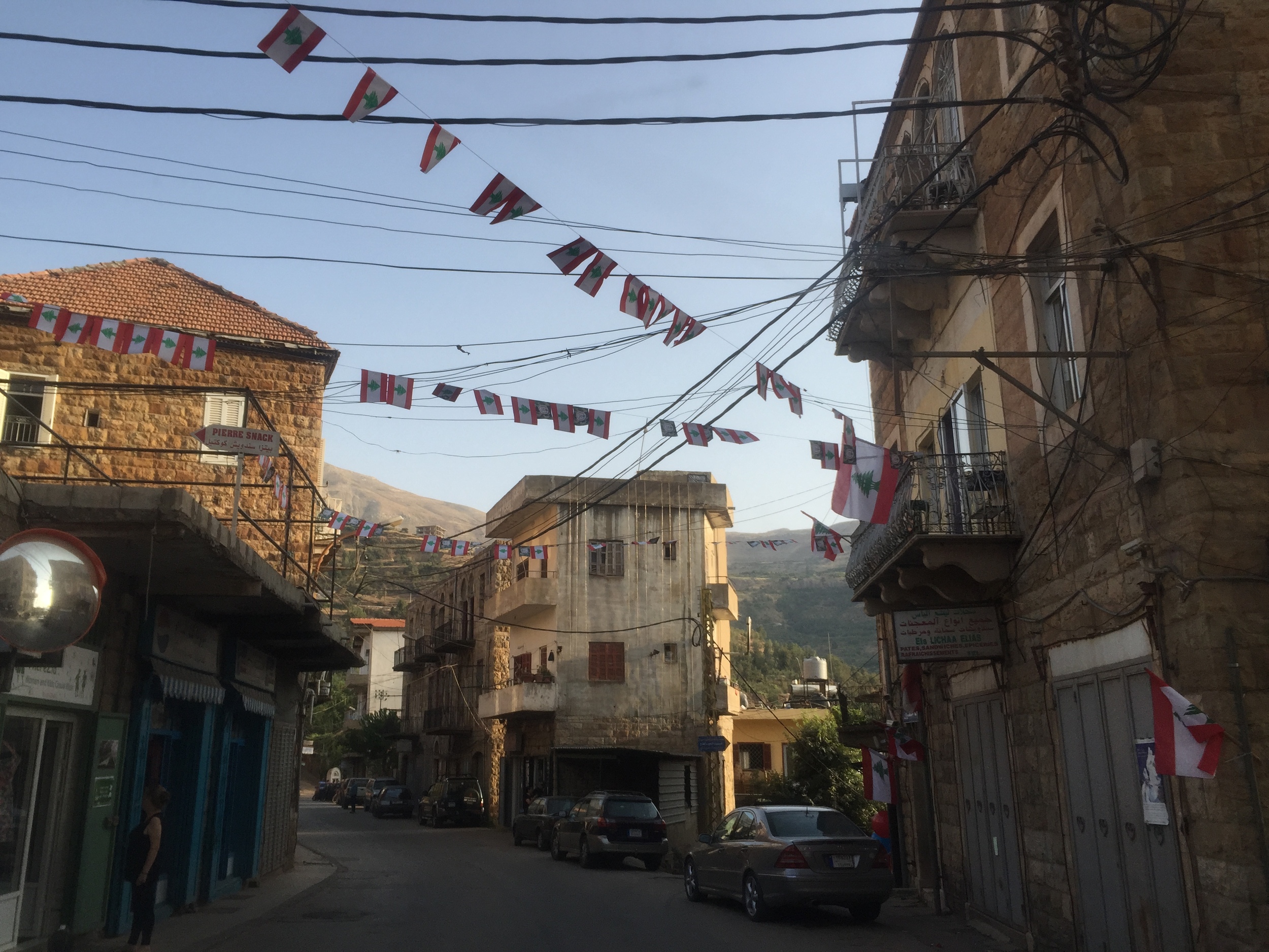   A small village in the mountains of Lebanon sports its patriotism with continuous lines of Lebanese flags. August, 2015.  