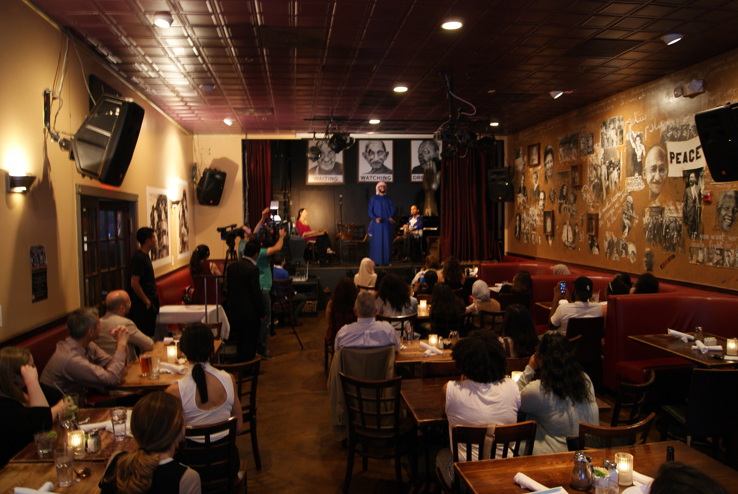   The audience gathers for  "RIWAYA: Spoken Word from the Gulf"  at Busboys &amp; Poets in Washington, D.C. June, 2016.  