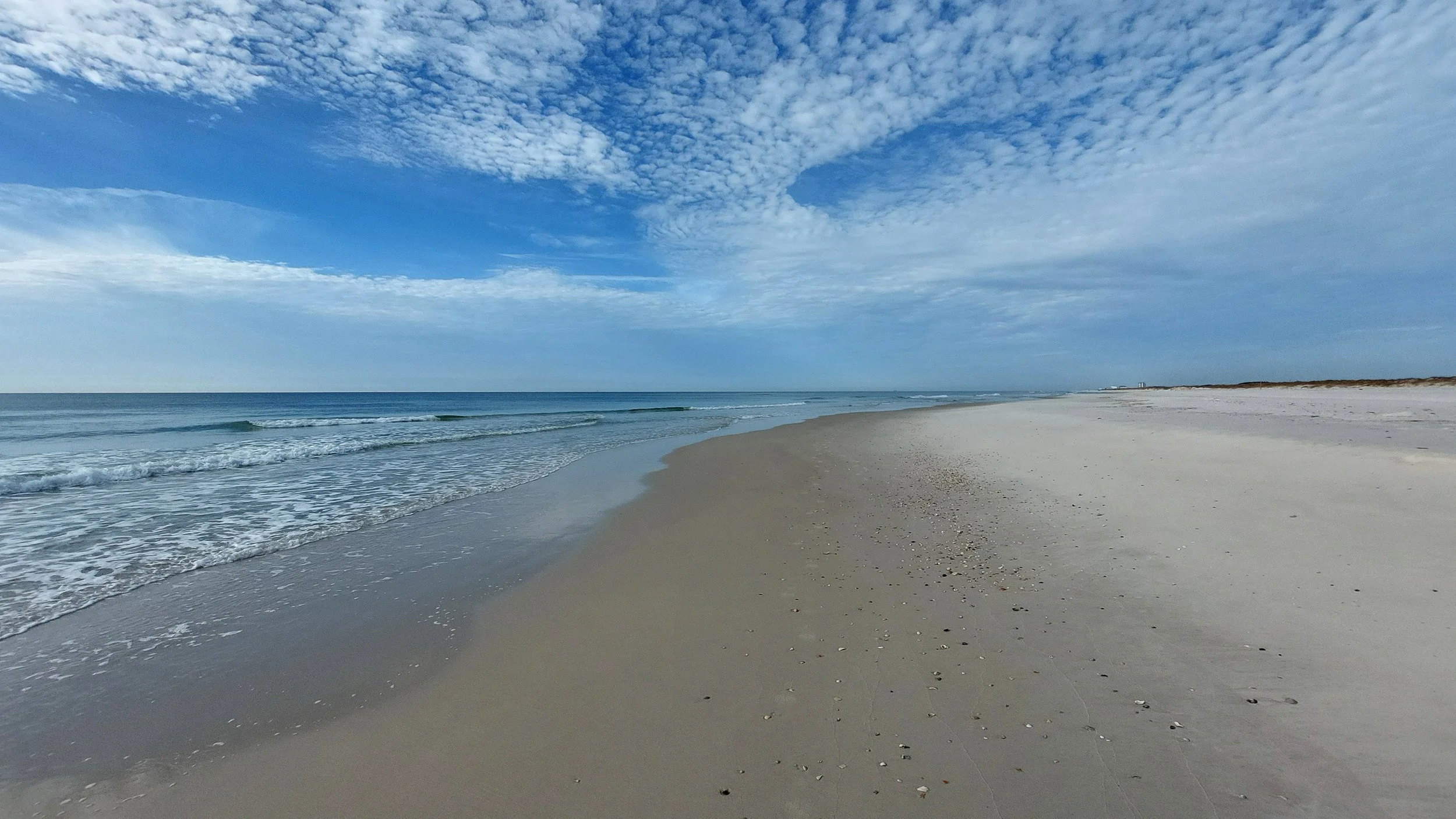  What do you see in this photo? At first, I was only awed by the majestic colors and composition of the sky and the clouds. But as I communed further with this artwork, I noticed the various hues in the sandy beach, and how the color palette of sand,