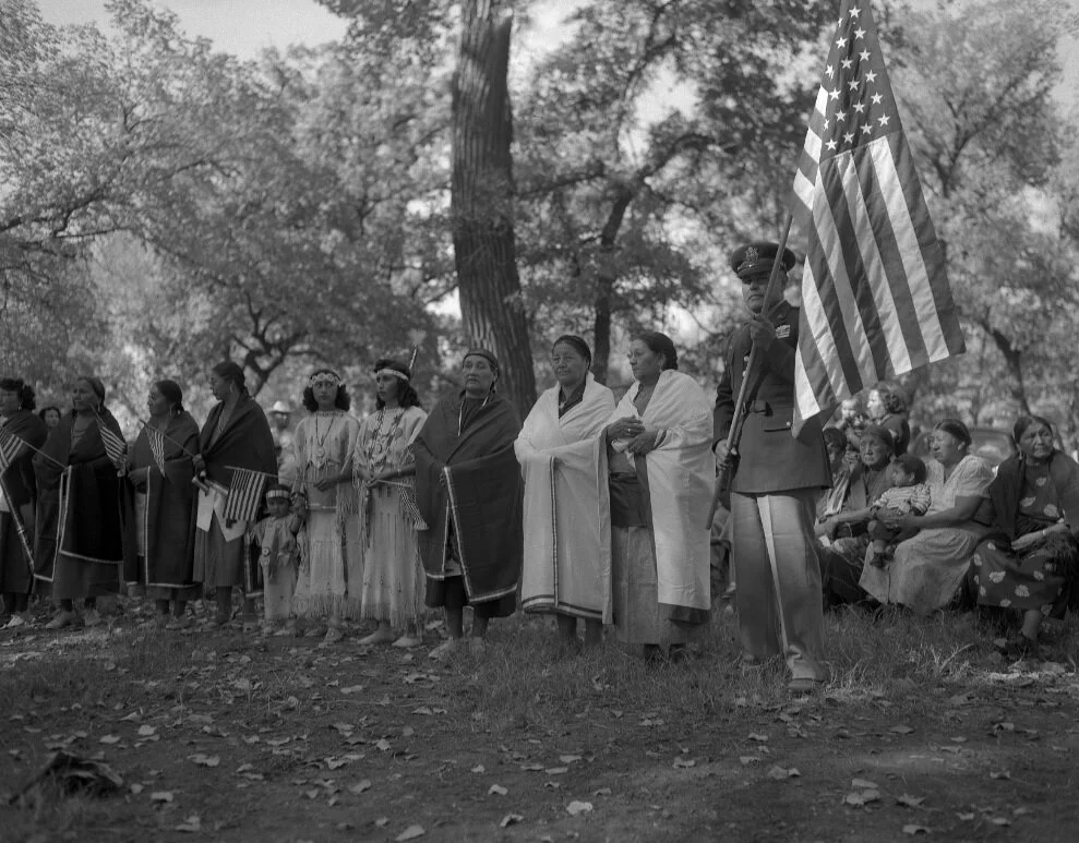 Image: onor dancewelcoming home Pascal Cleatus Poolaw Sr.(right, holding the American flag) after his service in theKorean War. To his right are members of the Kiowa WarMothers. Carnegie, Oklahoma, ca. 1952. Poolaw (Kiowa,1922–1967) remains the most…