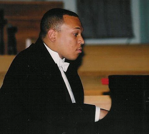 Victor Simonson (adult), a multi-disciplinary composer, conductor and pianist.