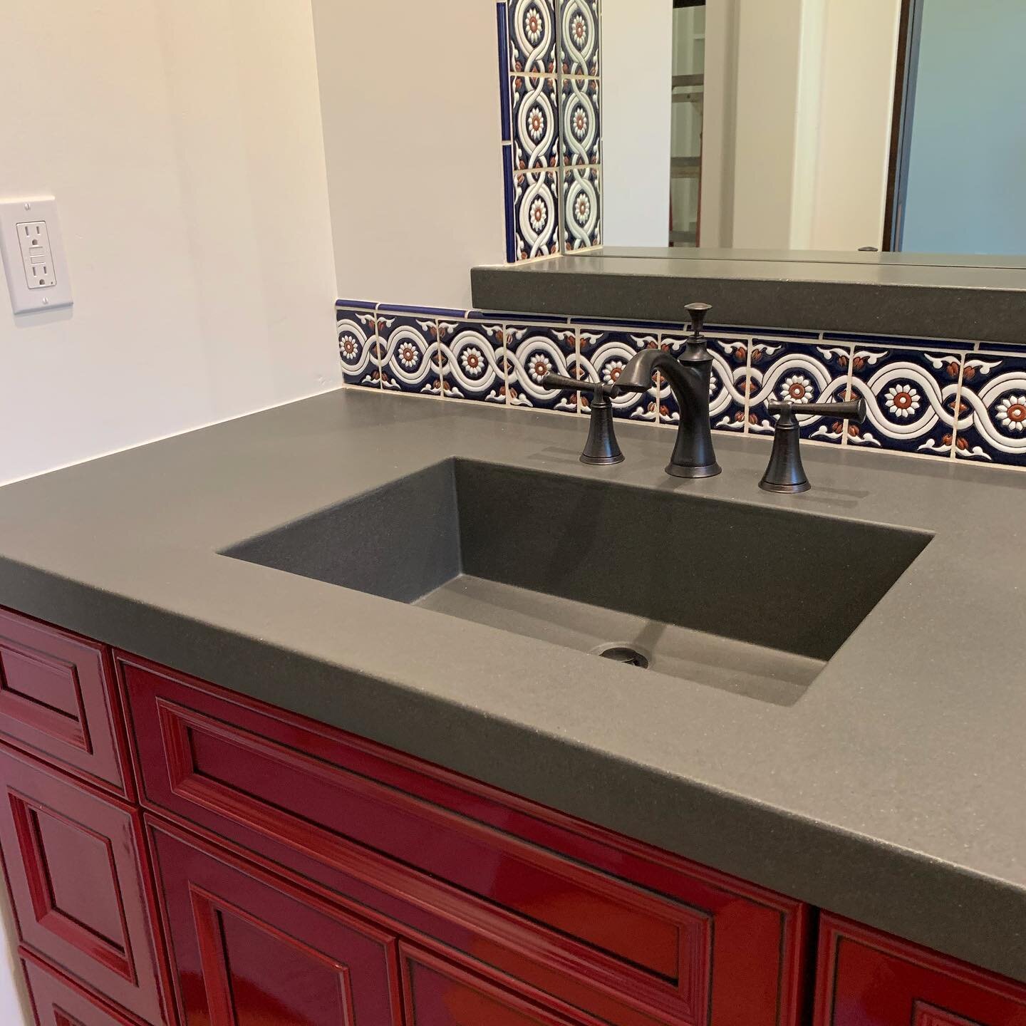 Never shy away from a pop of color for a boys bathroom or intricate tile designs, the steely gray concrete counters tie this space together for an overall masculine feel. The details continue to come together on this propriety and we can&rsquo;t wait