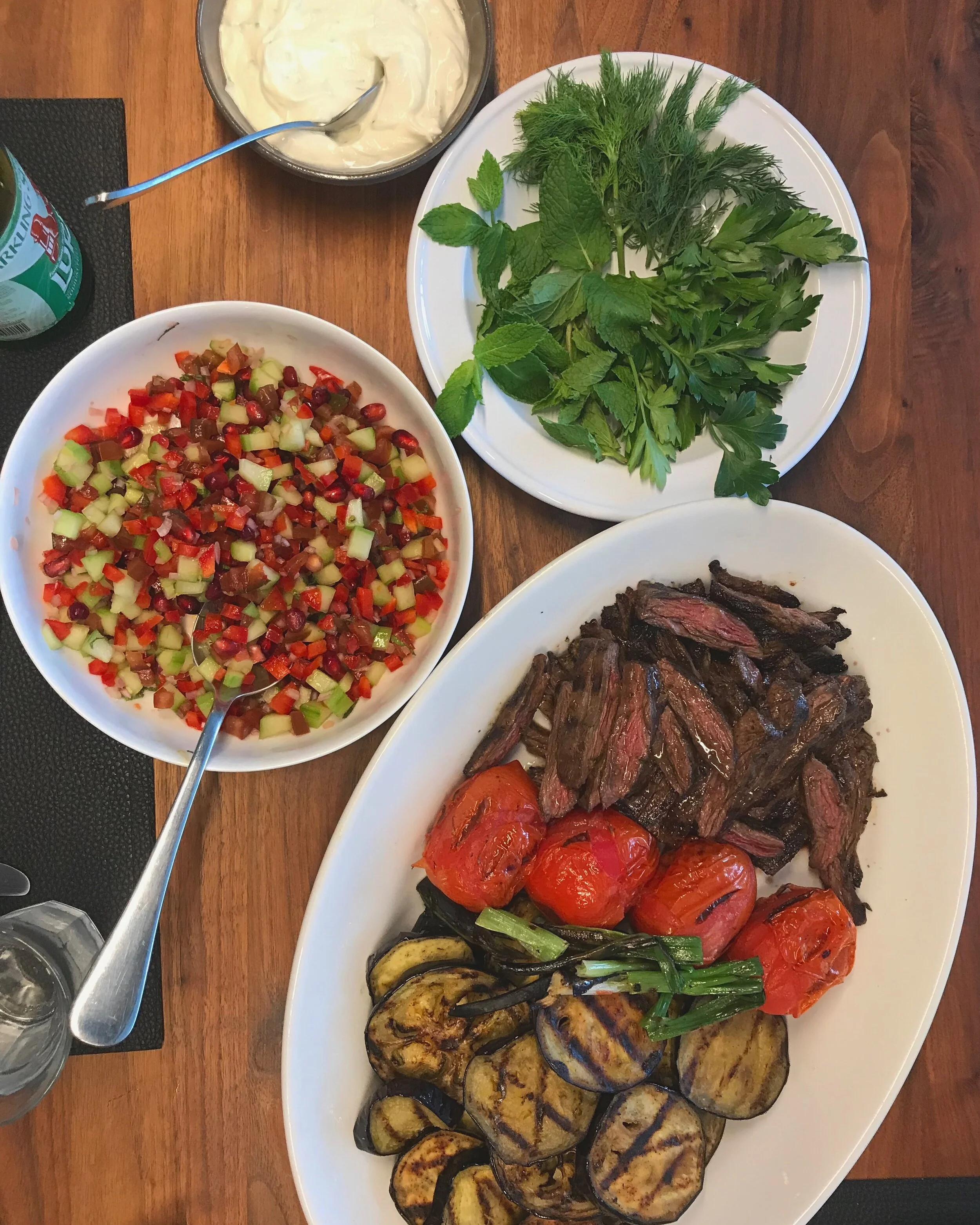 Grilled Flank Steak, Tomatoes, Eggplant with Shirazi, Hummus and Herbs