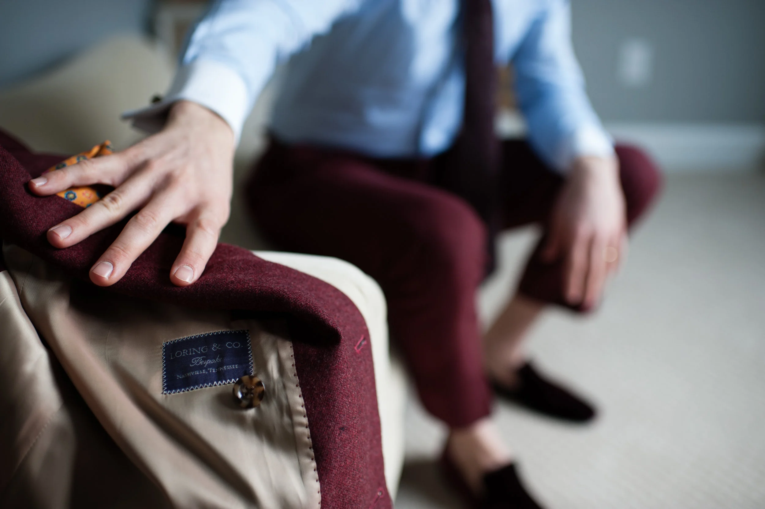 bespoke suits in Burgundy with orange square.jpg