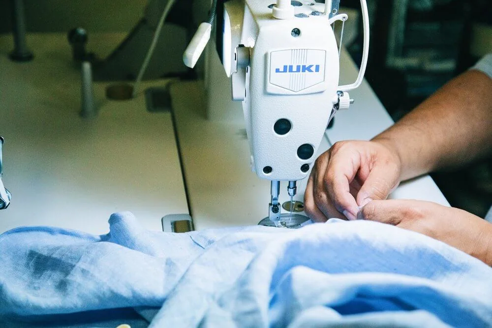 A seamstress in Nashville sewing a shirt