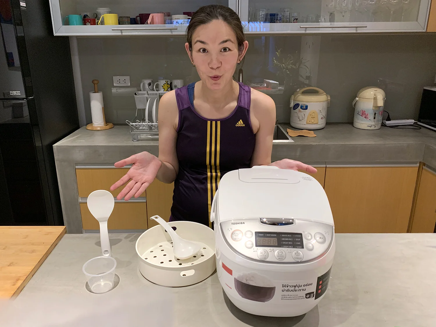 After 11 years, our reliable Sharp rice cooker bit the dust. Here's our fancy new Toshiba one.