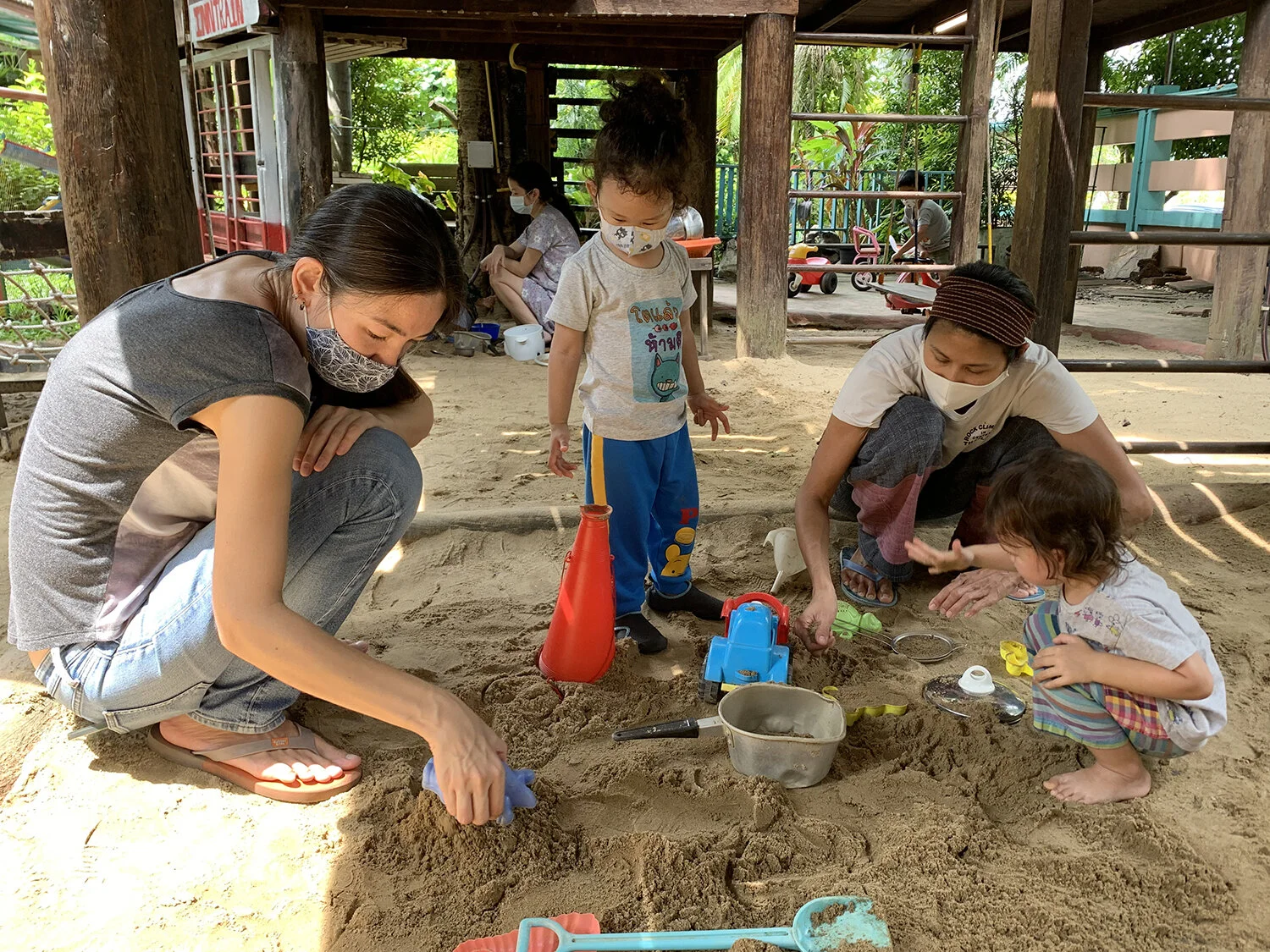 Playing "with" Quinn in the sand.