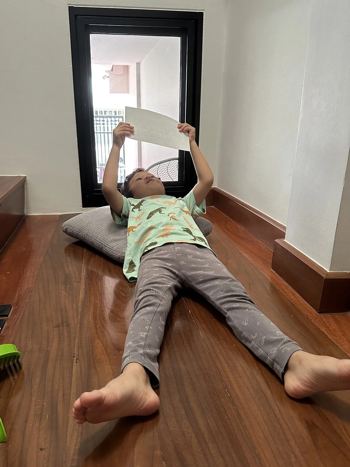 Oh, there he is! Lying on the steps and "reading his newspaper."