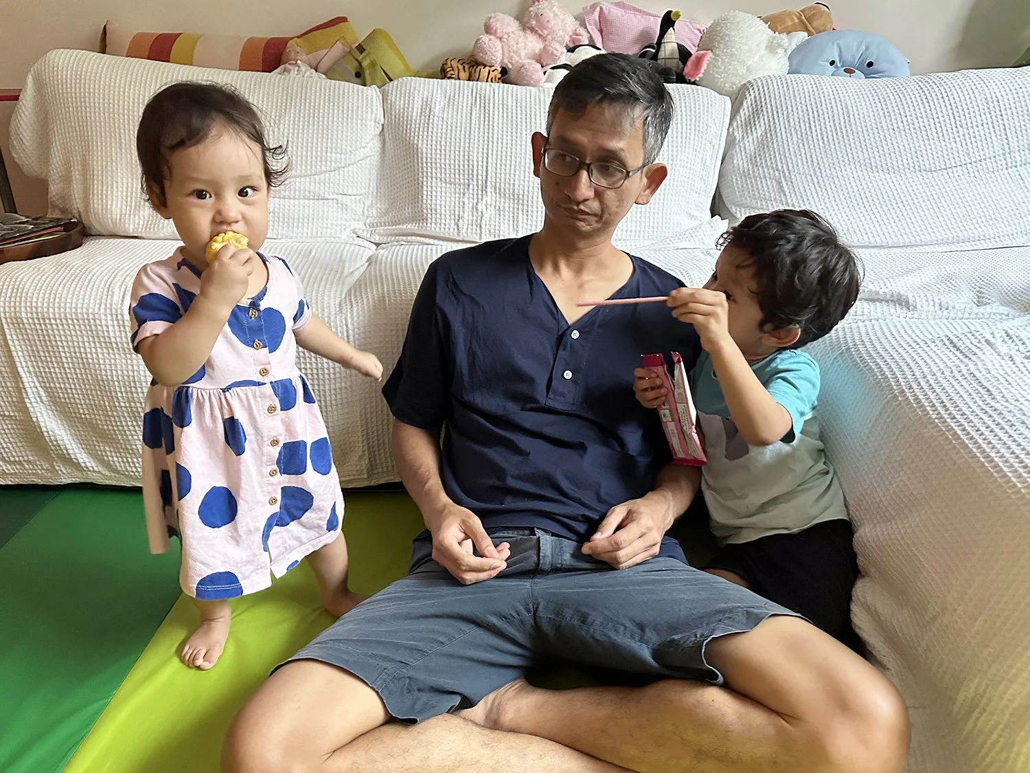 Dad is surrounded by a corn monster and a Pocky monster.
