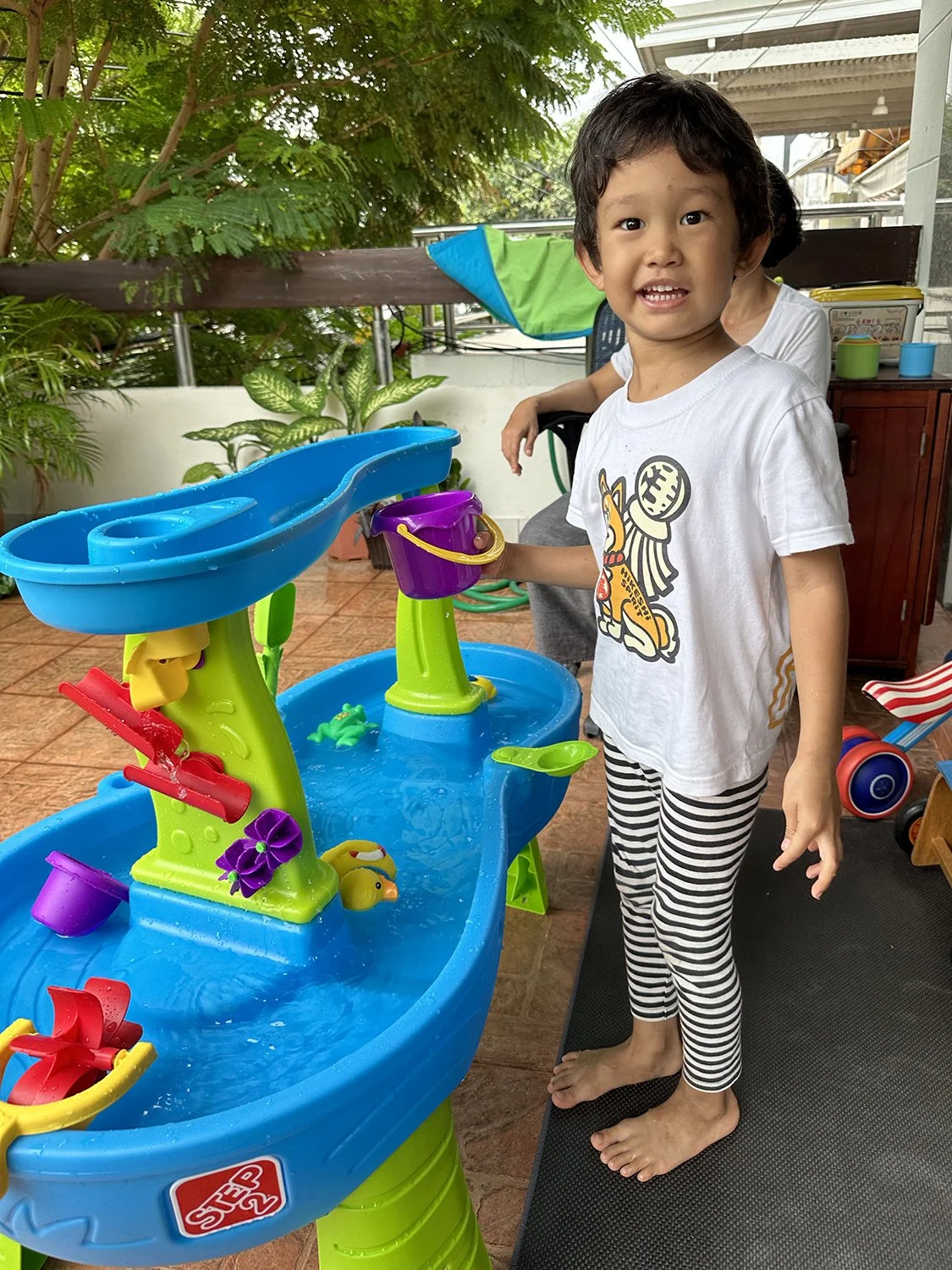 Arlo rushed home from school to play with the water table while Lucy still napped.