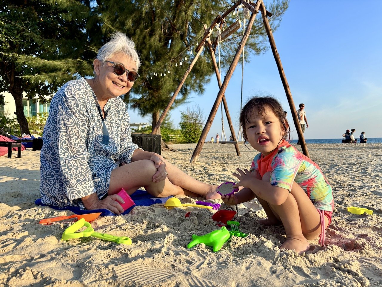 Playing in the sand; Lucy's clearly gotten lots of practice at school since last visit!