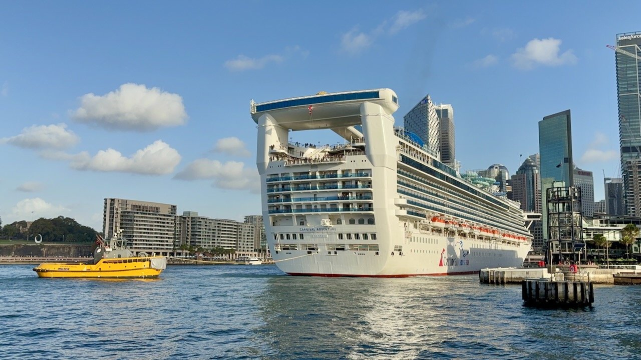We were there to see these tiny tug boats pulling this giant cruise ship back out into the harbor.