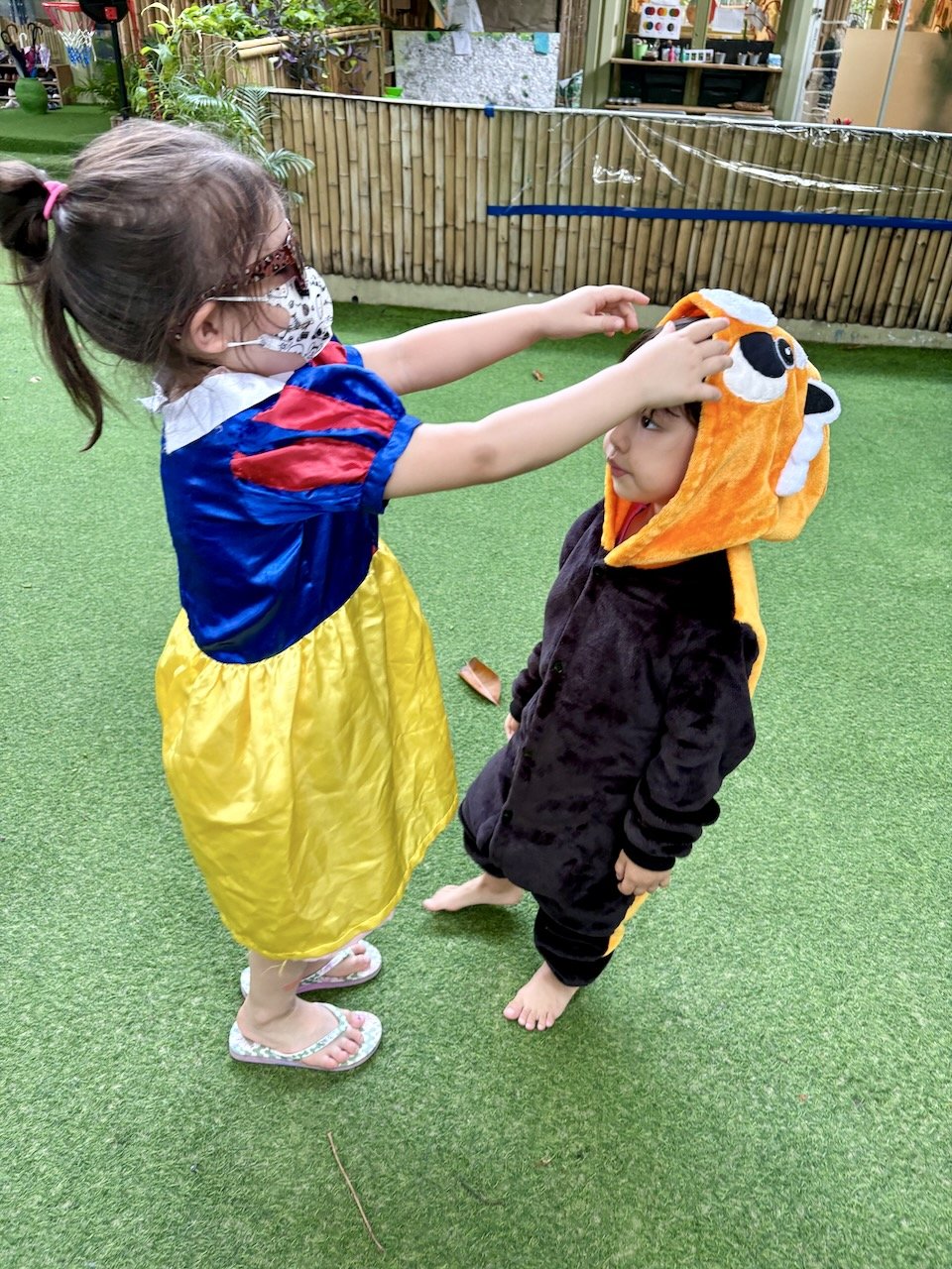 Jordan is kindly helping fix the ears of this little red panda.