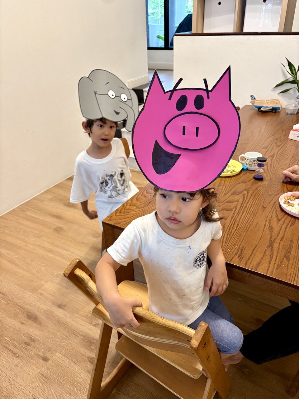 Trying on the hats to make sure they fit.