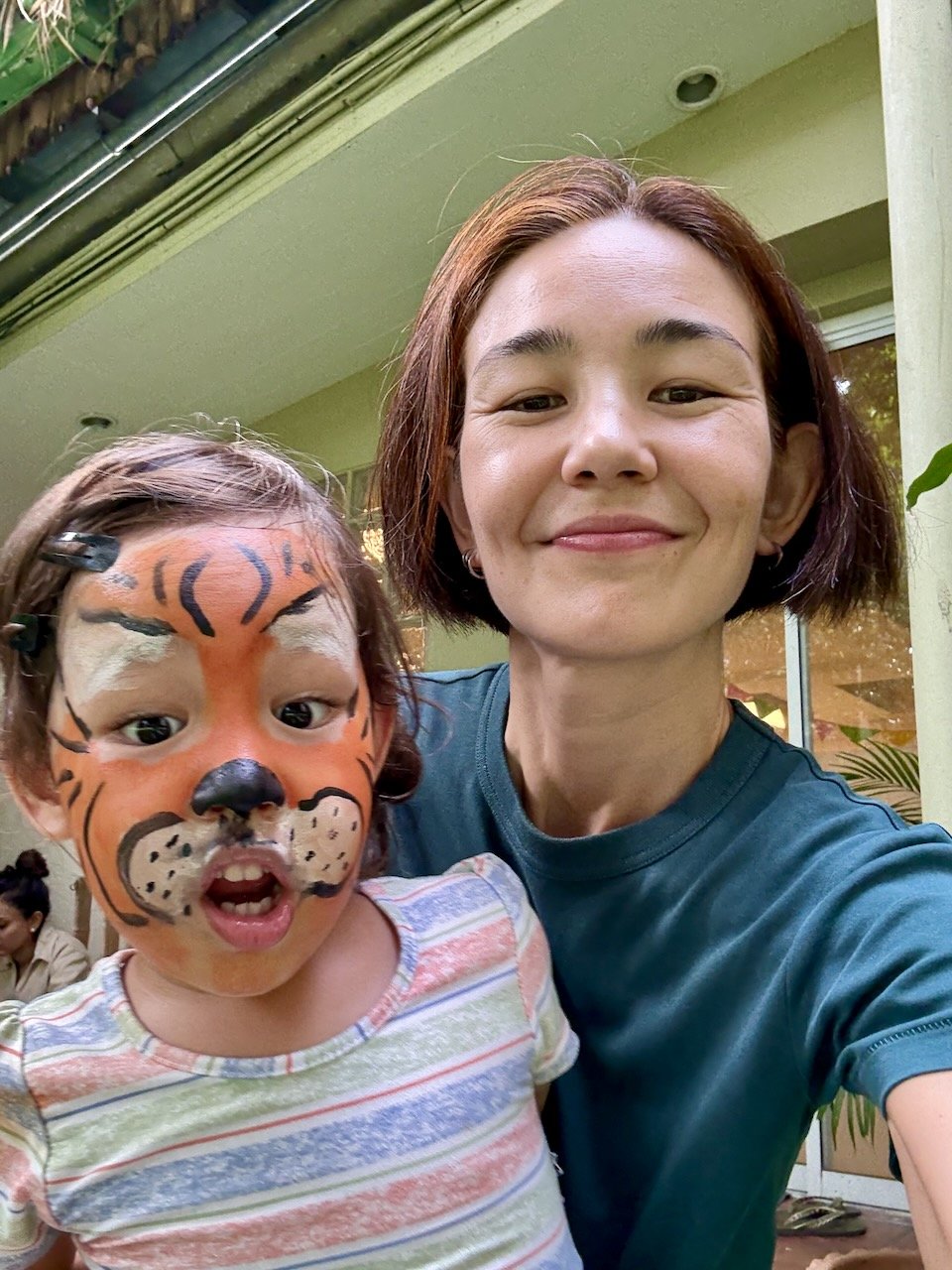 The tiger seems surprised to see herself in the camera, too!