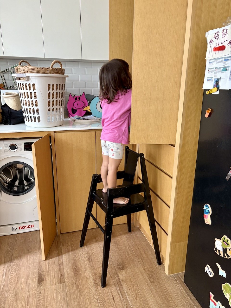 Helping herself to snacks.