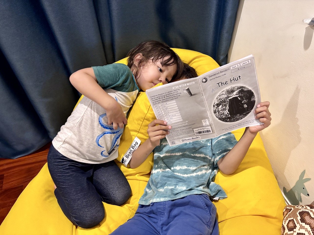 Reading his phonics book to Lucy before bed.