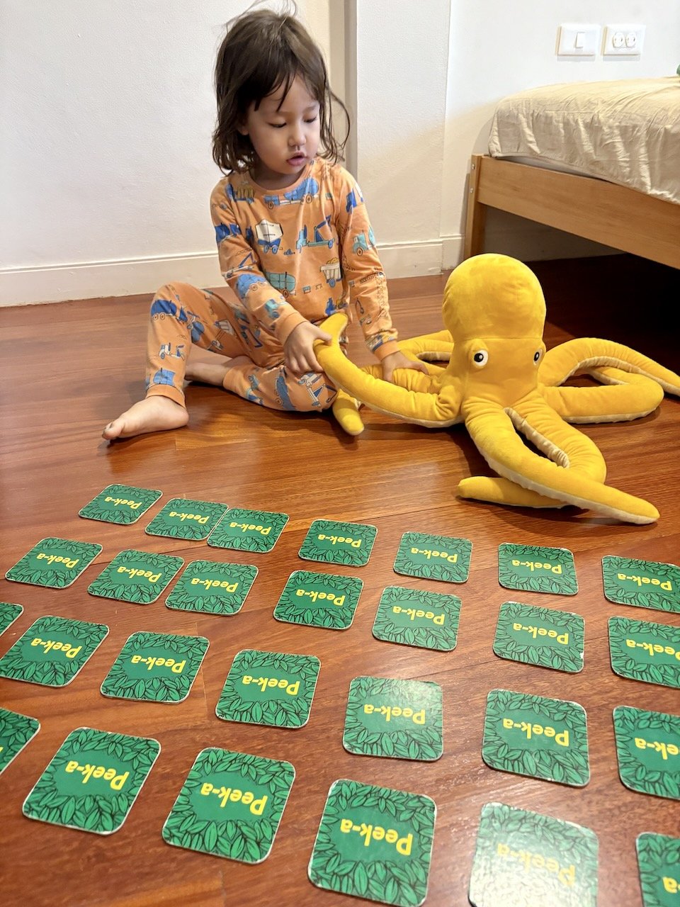 Can't get ready for school without playing a game of memory with her octapus.