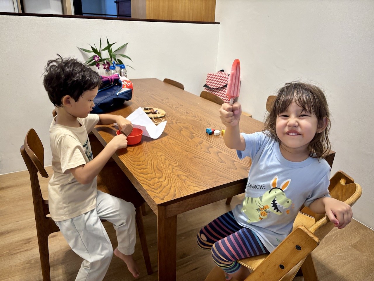 Enjoying their ice creams.