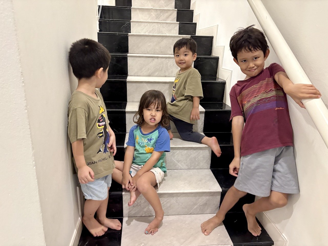 All the monkeys (except the littlest), trying to wait out the rain.