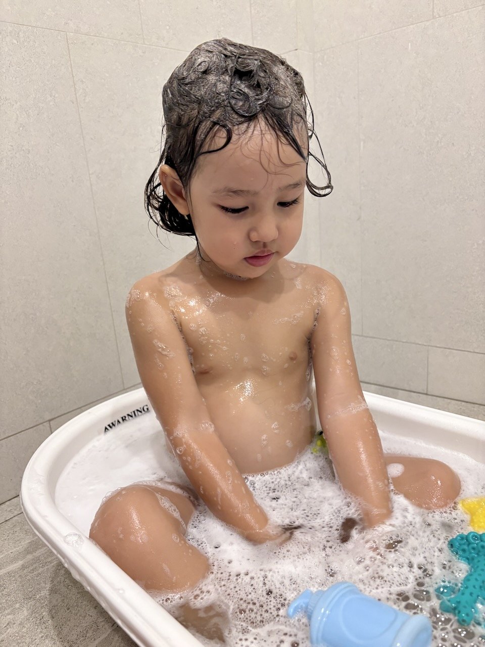 Lucy rediscovered her baby bathtub.