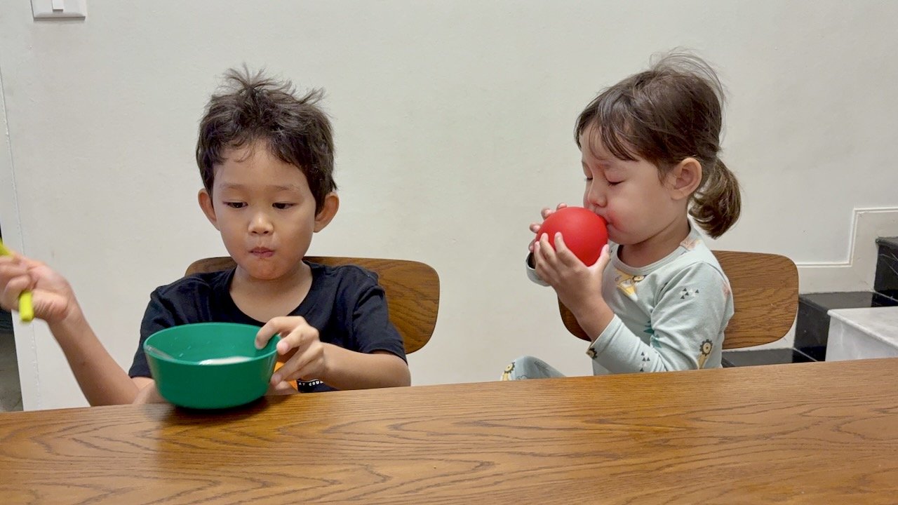 Arlo's found a new favorite breakfast -- milo balls in milk -- while Lucy cant stop inflating balloons.