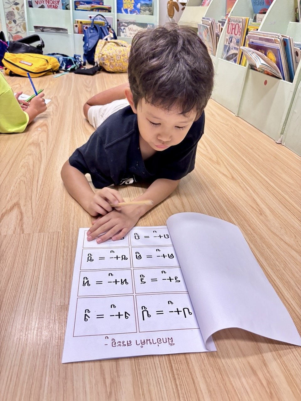 Practicing his Thai, slowly but surely.