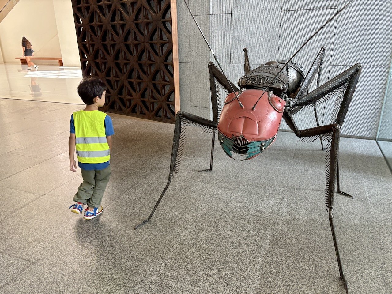 Taking in the giant bug in the entrance, on the way out.