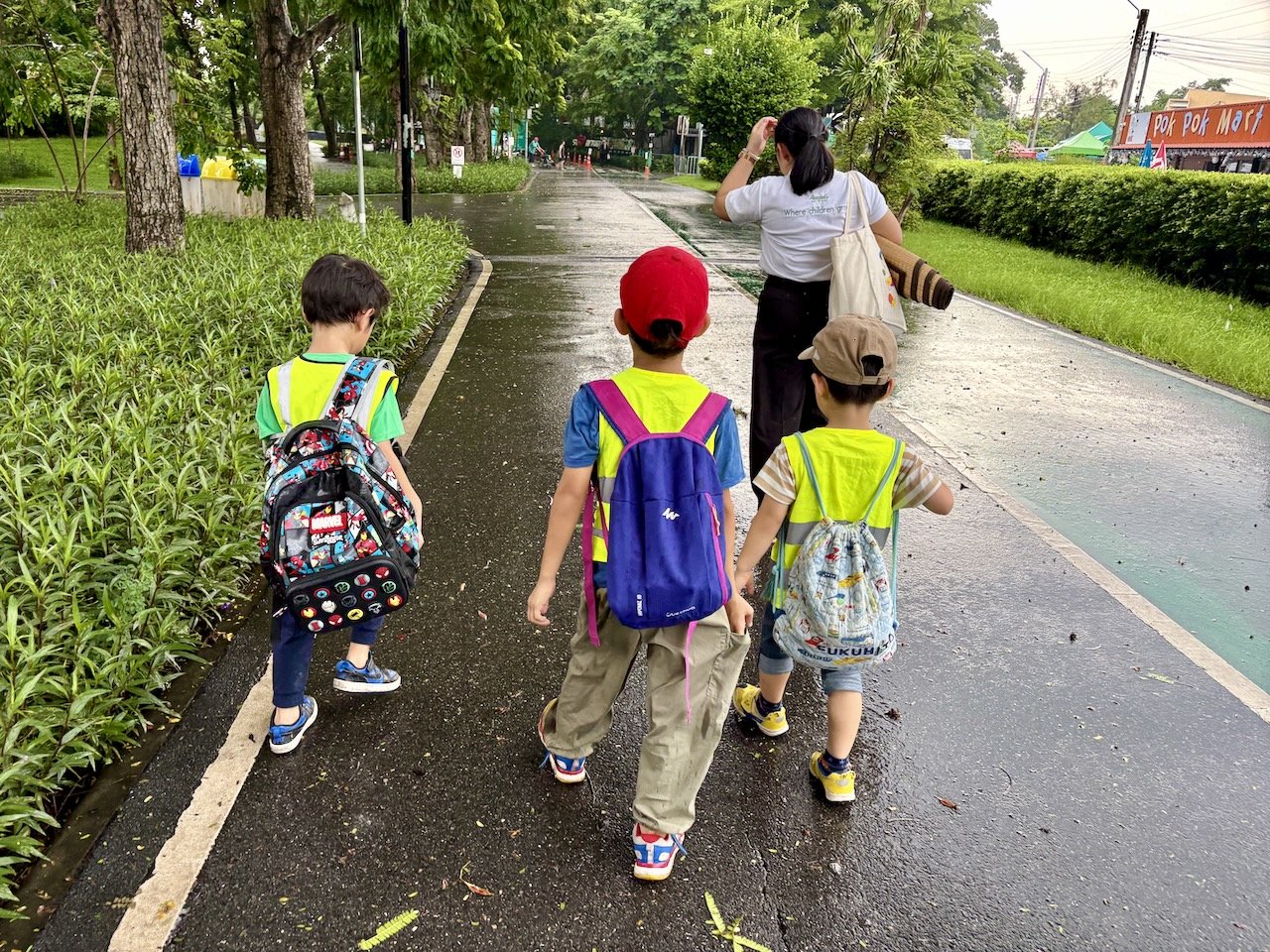 Heading back to the vans, after camping in the toilets for the heaviest of the rain.