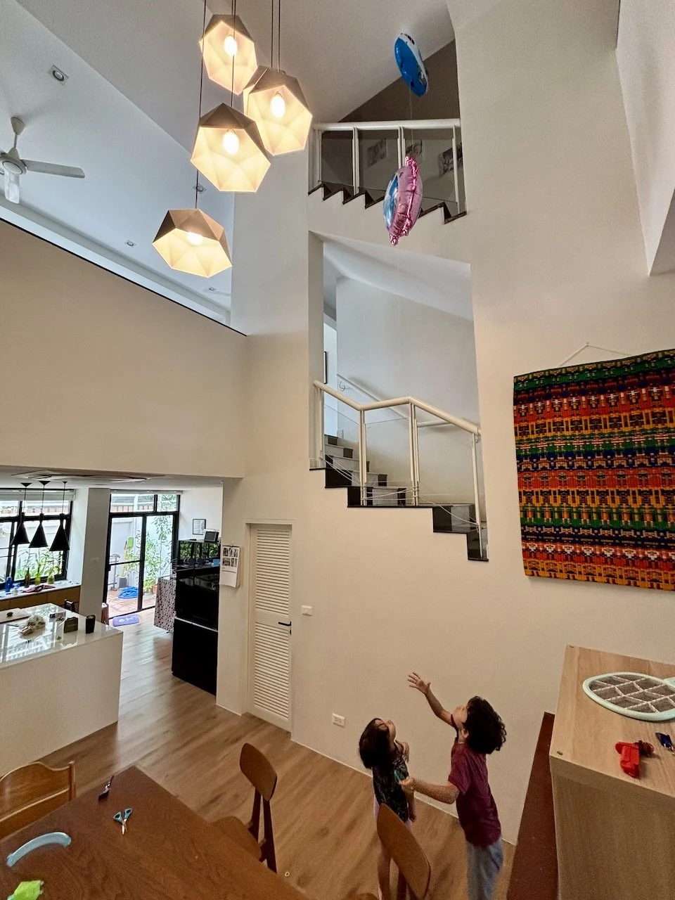 Helium balloons require very long strings in this house!