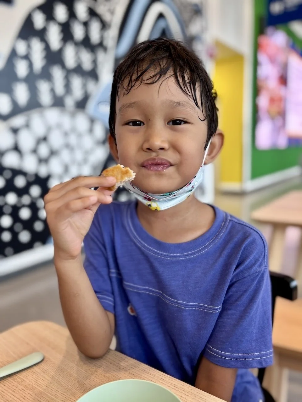 Chowing down on his (real) chicken nuggets.