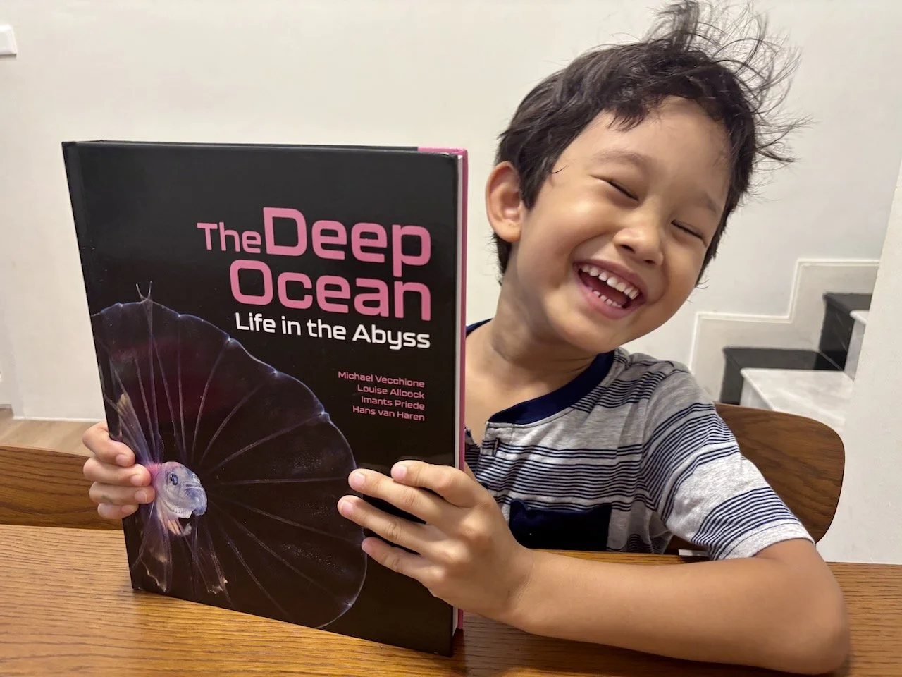 Arlo's textbook finally arrived, and he's thrilled!