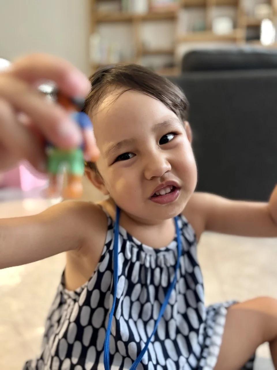 Playing with her little people.