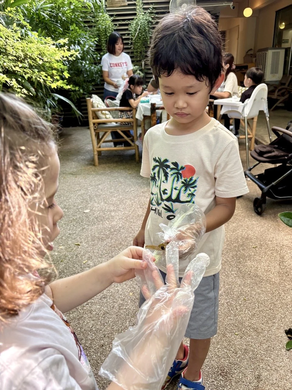Wearing gloves to catch snails.