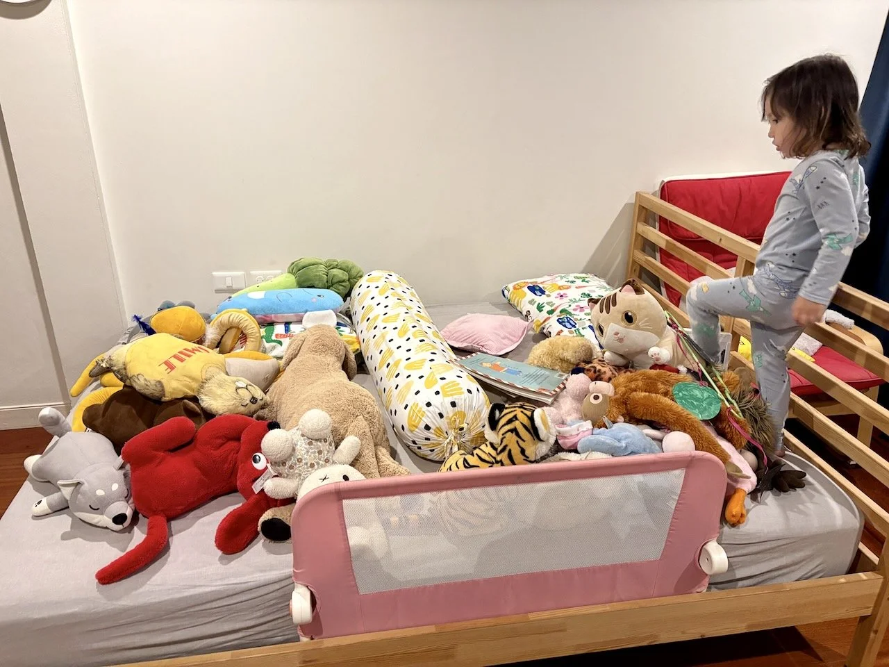Meanwhile, Lucy's created an airplane: the body pillow divides the adult section from the kids section. And the animals are divided into adults (large) and kids (small).