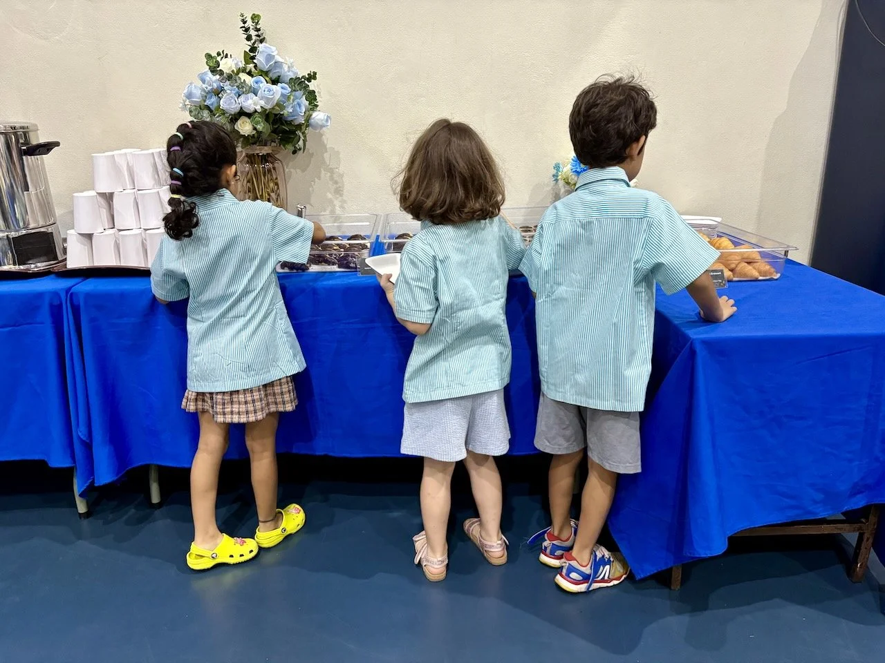 Feeling grown up: helping themselves to the snack table.