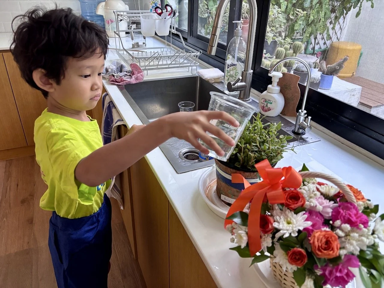 Taking good care of the flowers he received at graduation.