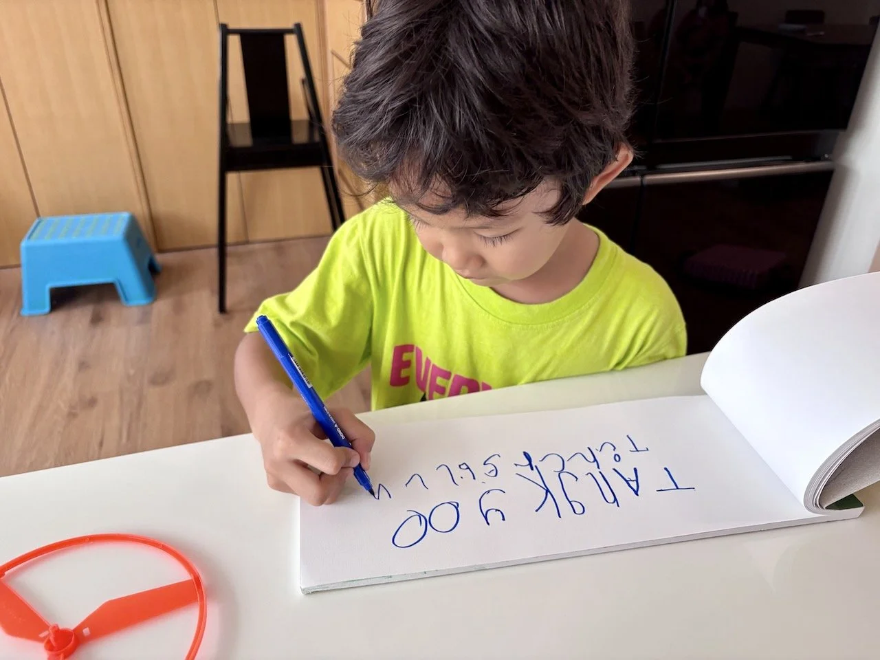 Practicing for the thank-you card that we're going to make later.
