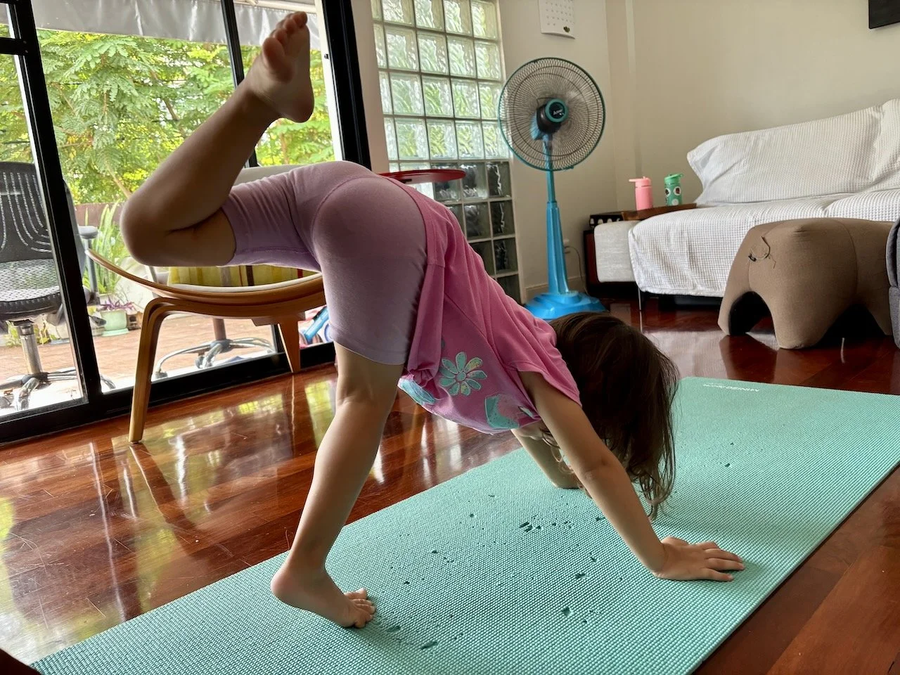 Practicing her yoga.