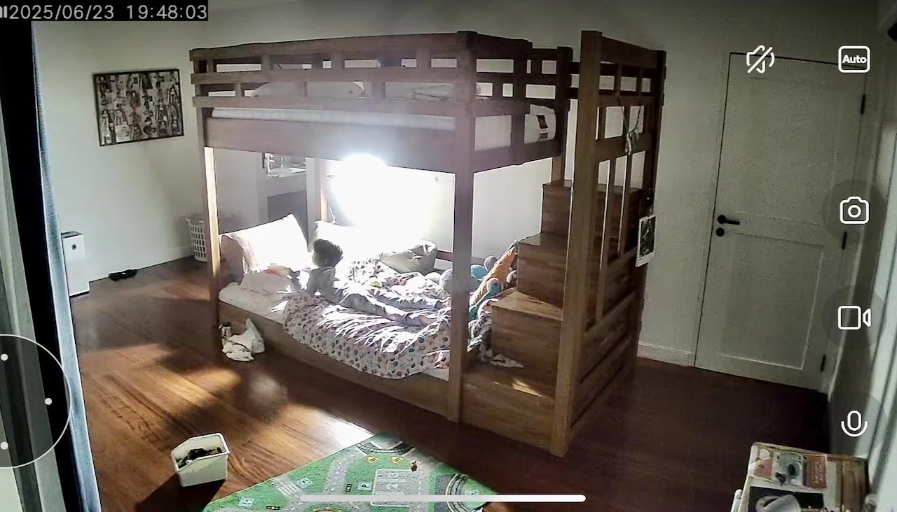 Reading to himself after lights out.