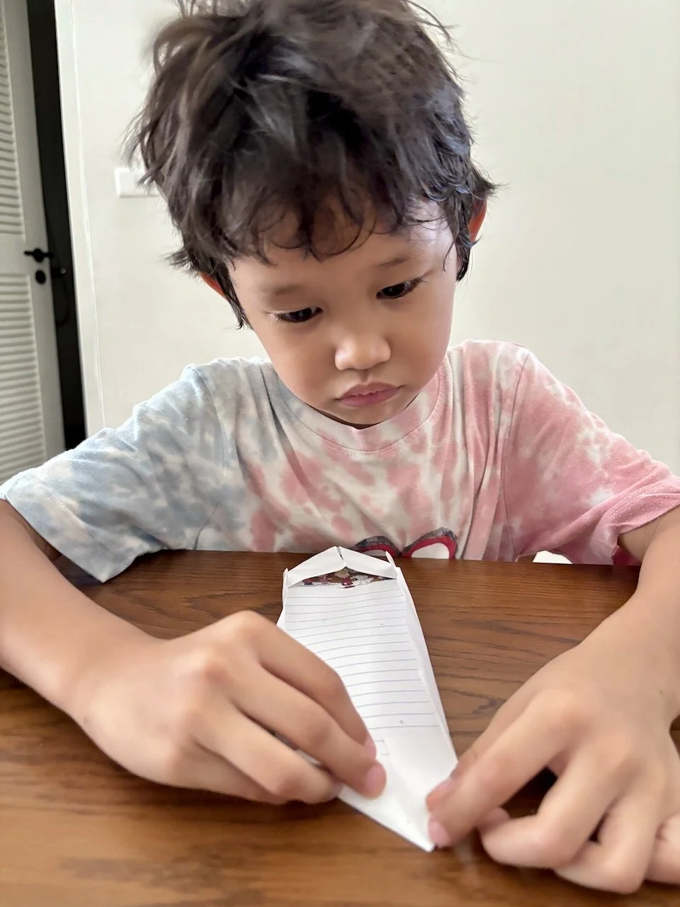 Folding an envelope.