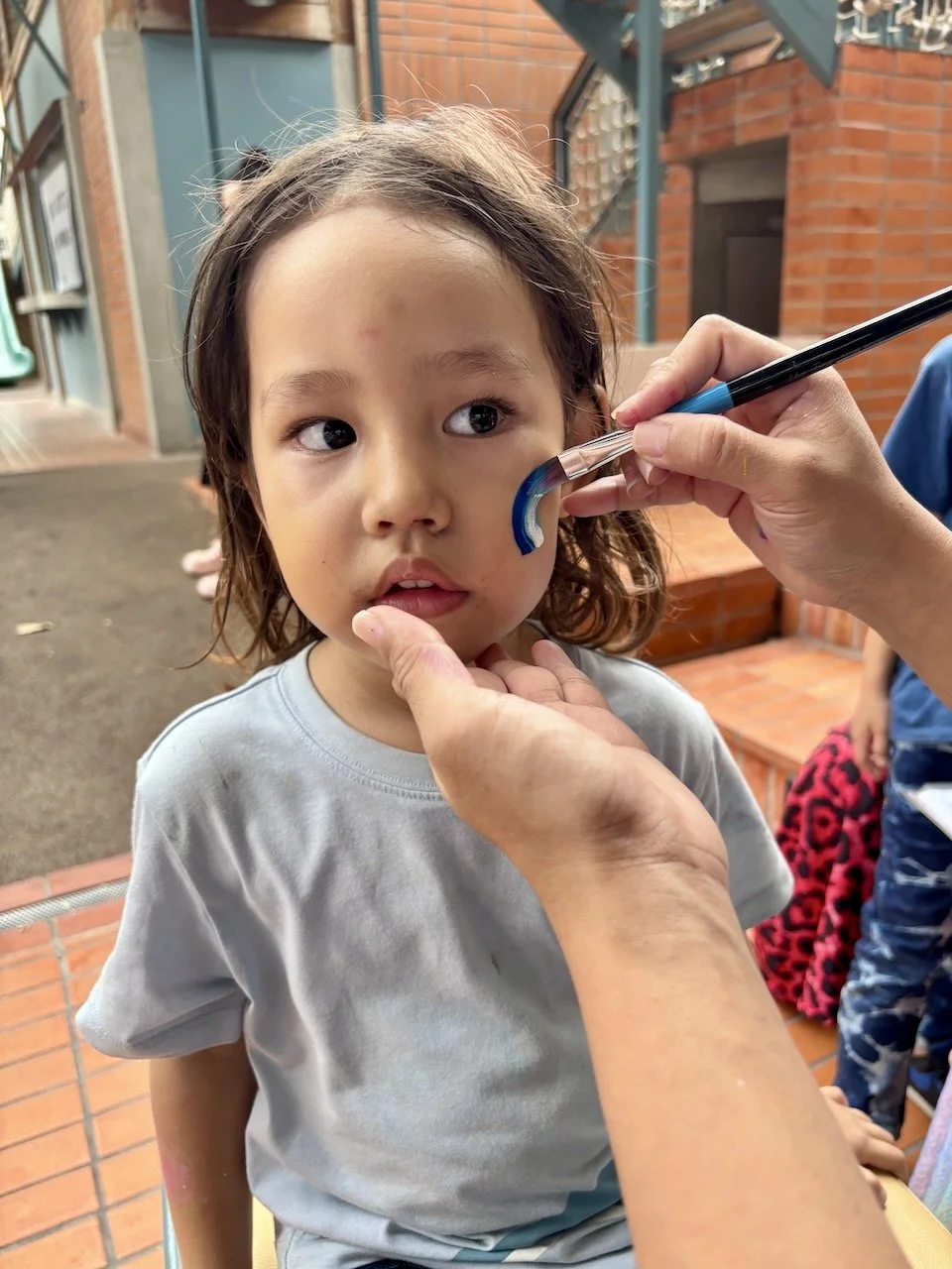 Wait. One more face paint for Lucy.