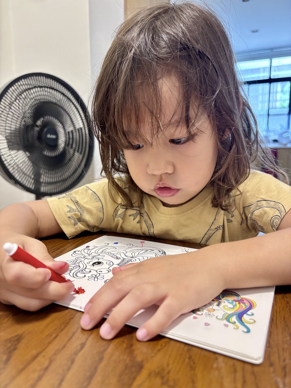 At breakfast, the focus continues: concentrating on coloring.