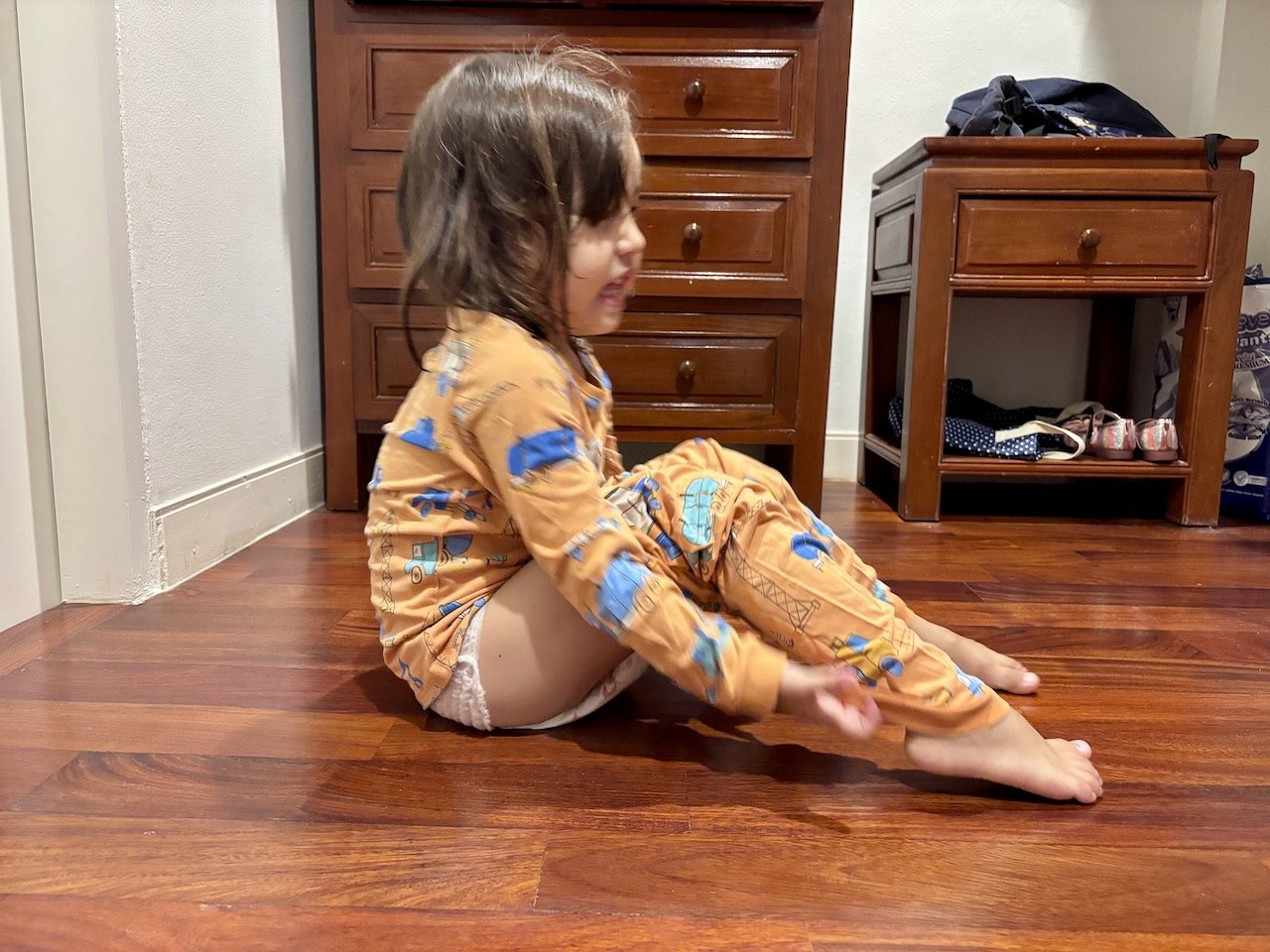 Dressing herself with confidence.