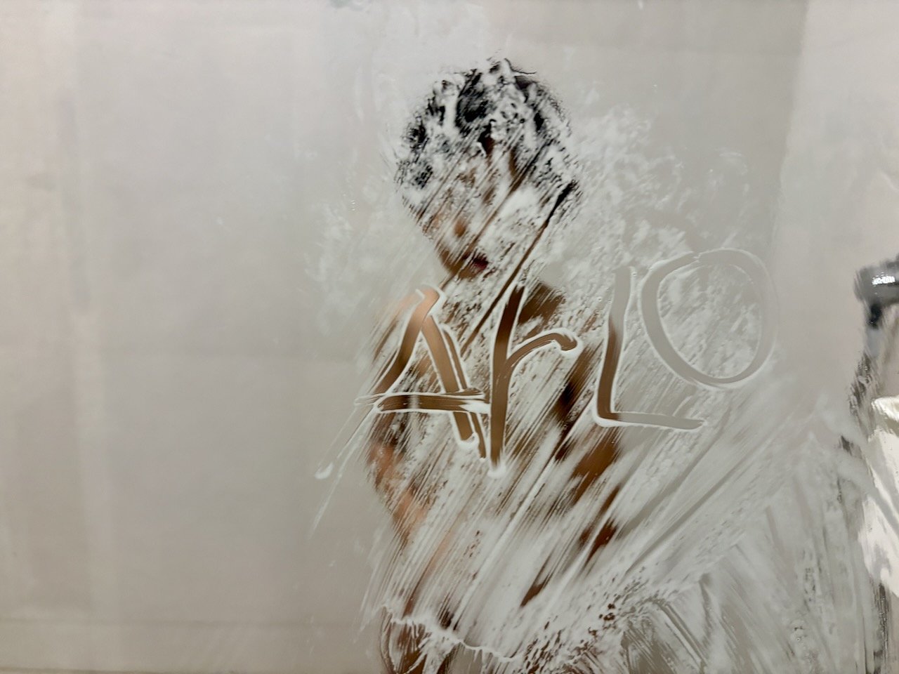 Challenge accepted: Arlo wrote his name so that it faced the right way for me, standing outside the shower.