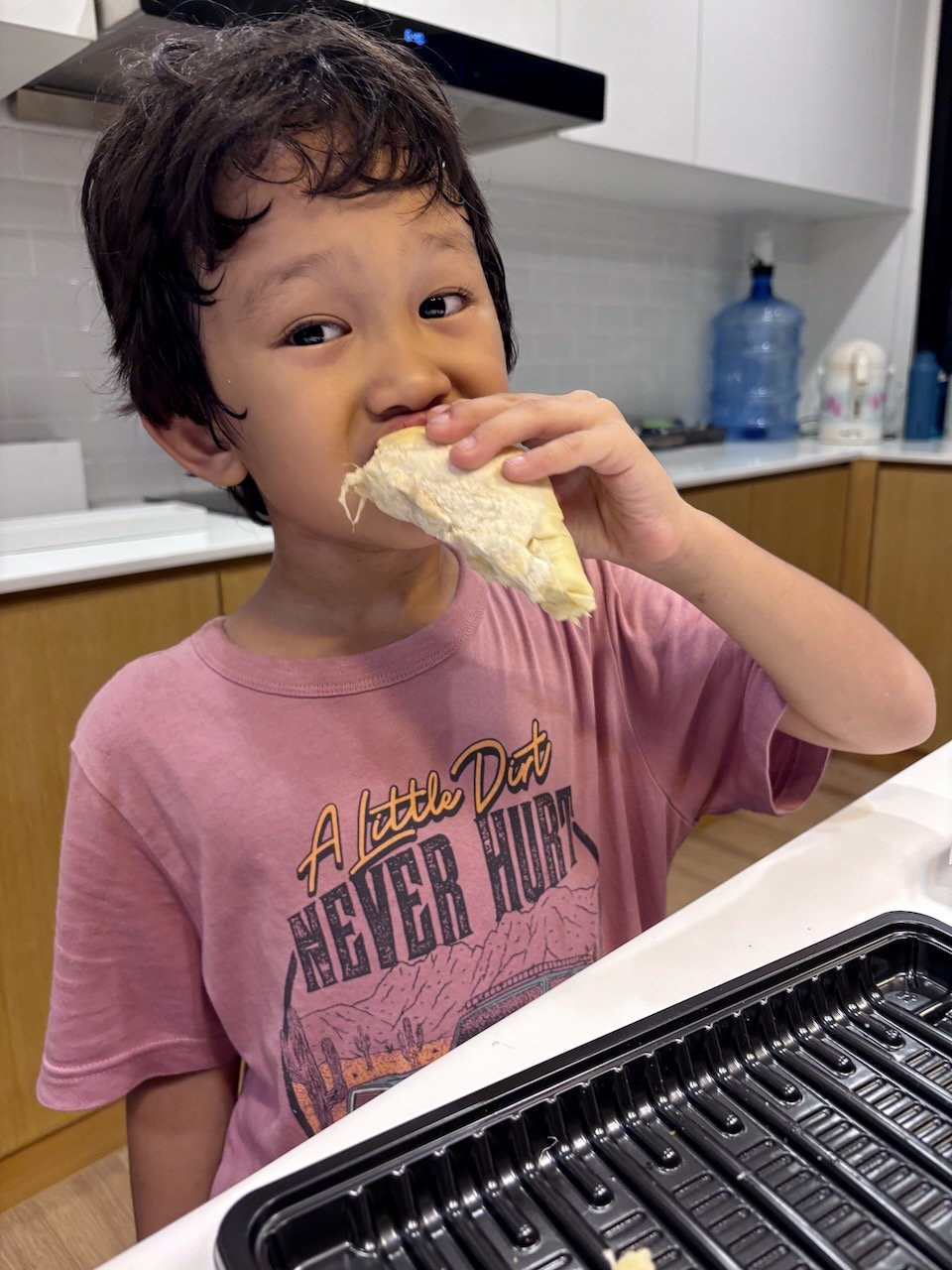 Enjoying his first durian of the season - what a real Thai boy!