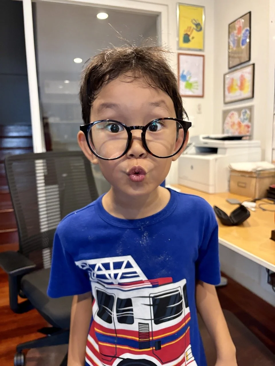 Trying on Mum's funny glasses.